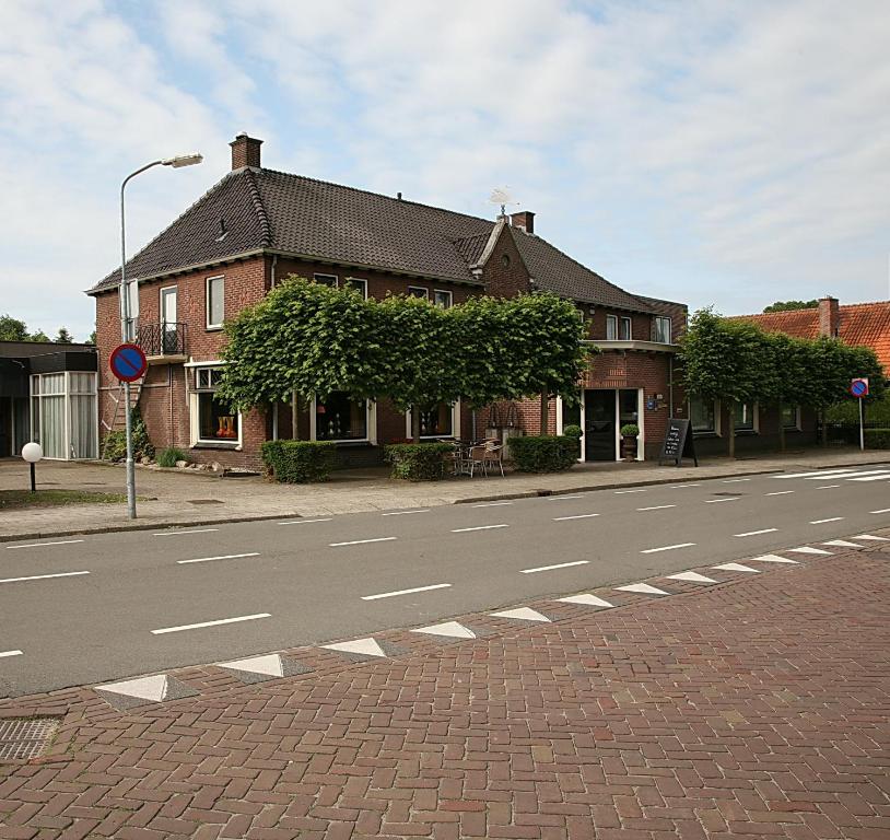 a building on the side of a street at Hotel Bi-j Ons in Lichtenvoorde