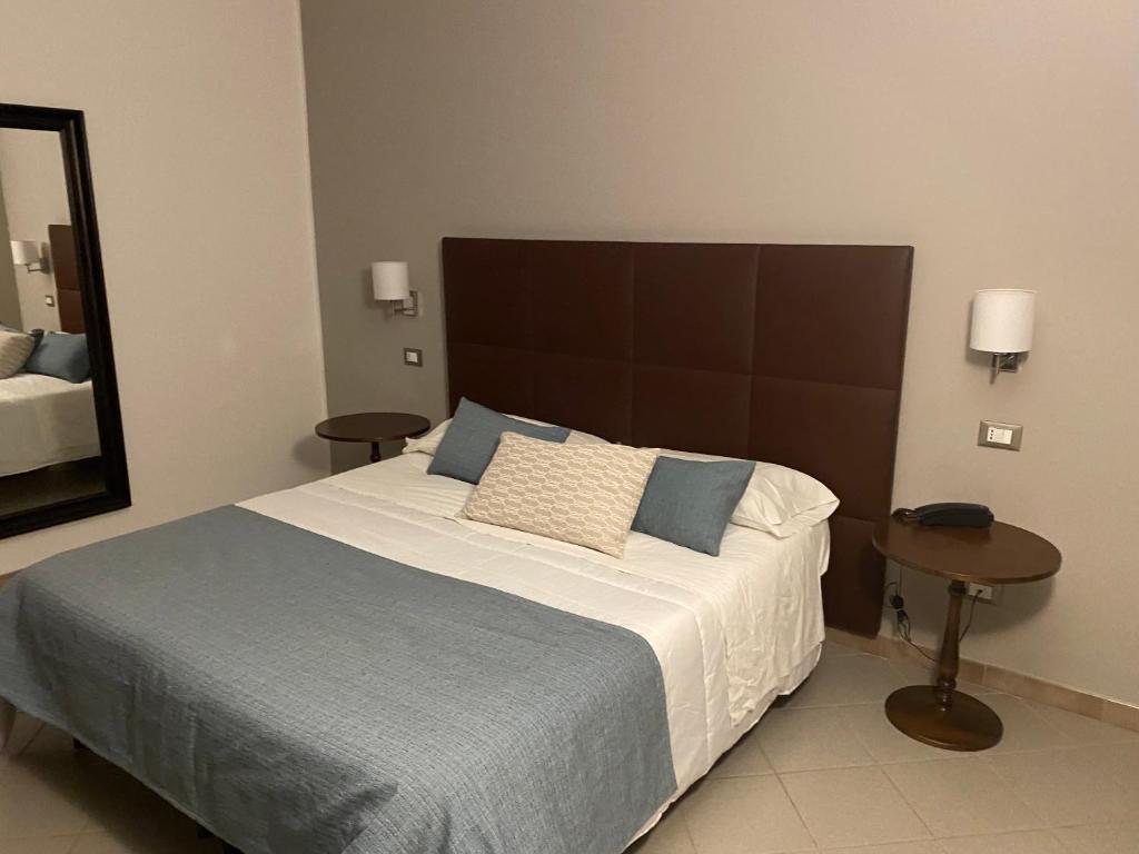 Postel nebo postele na pokoji v ubytování Hotel Moderno