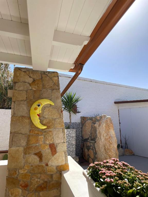 a stone wall with a banana carved into it at B&B SoleLuna in Lampedusa