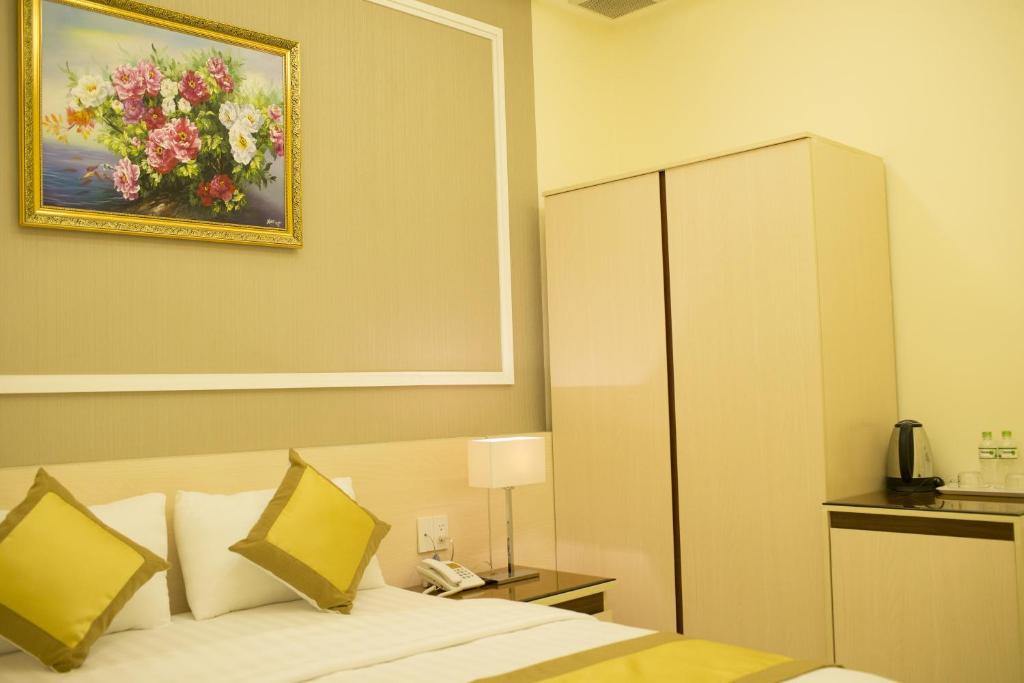 Postel nebo postele na pokoji v ubytování Hotel Hoang Minh Chau