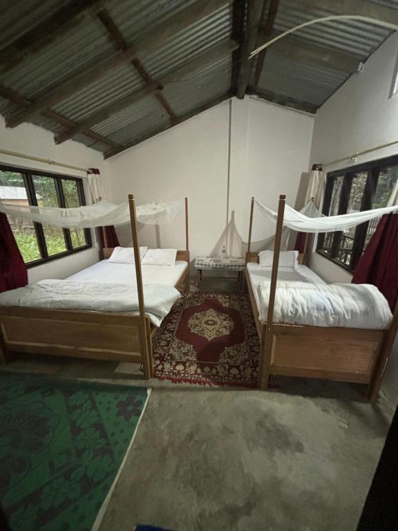 Postel nebo postele na pokoji v ubytování Nanu's Bardiya Homestay