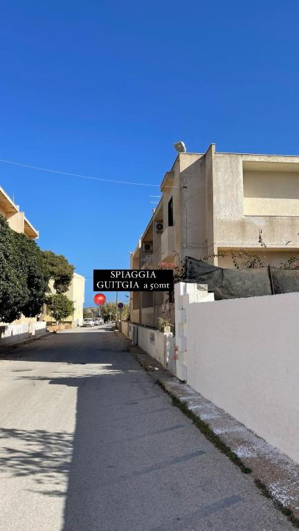 an empty street in front of a building at B&B SoleLuna in Lampedusa