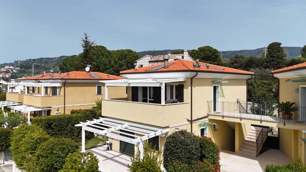 a row of houses with orange roofs at S334 - Sirolo, meraviglioso trilocale panoramico in Sirolo