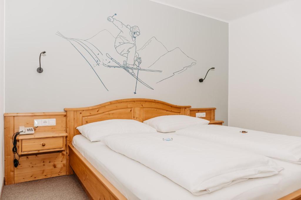 Postel nebo postele na pokoji v ubytování Hotel Grünwaldkopf