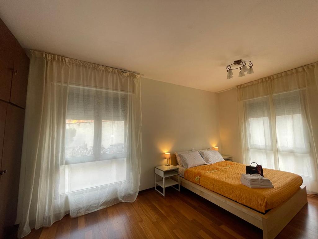 a bedroom with a bed and a large window at Forte Marghera 119 in Venice