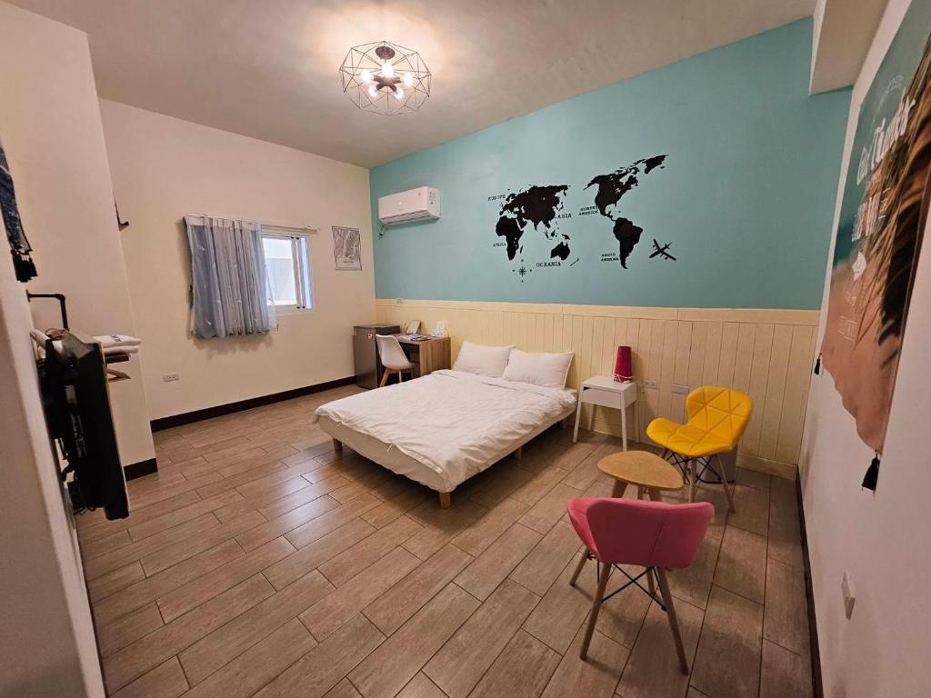 Postel nebo postele na pokoji v ubytování 澎湖紙飛機民宿Paper Jet B&B