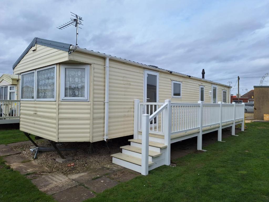a tiny house with a staircase in a yard at Seaview Ingoldmells Bromley 10 Berth 4 Bedrooms FREE WIFI in Ingoldmells