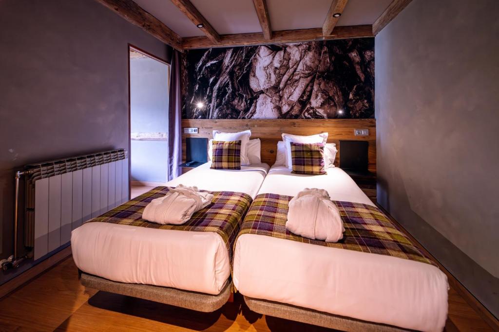 Postel nebo postele na pokoji v ubytování Hotel AnyosPark Mountain & Wellness Resort