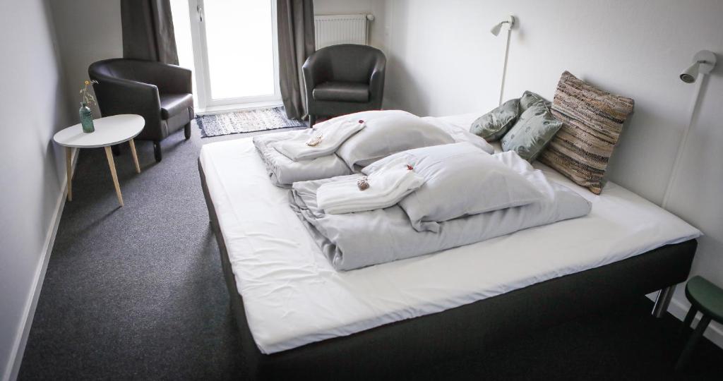 A bed or beds in a room at B&B by the Sea Hirtshals