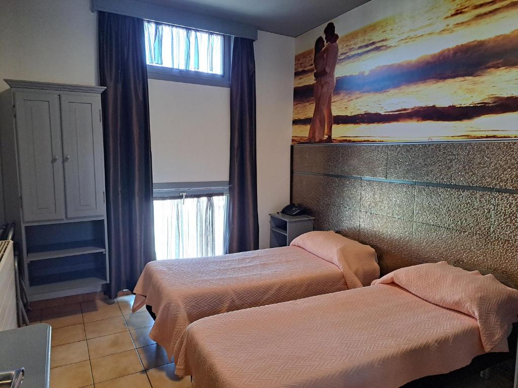 Postel nebo postele na pokoji v ubytování Le New Matinal