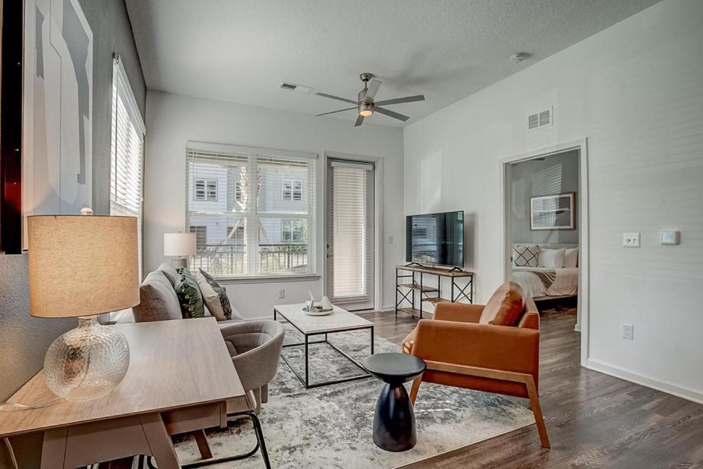 a living room with a couch and a table at Landing at San Marco Promenade - 1 Bedroom in San Marco in Jacksonville