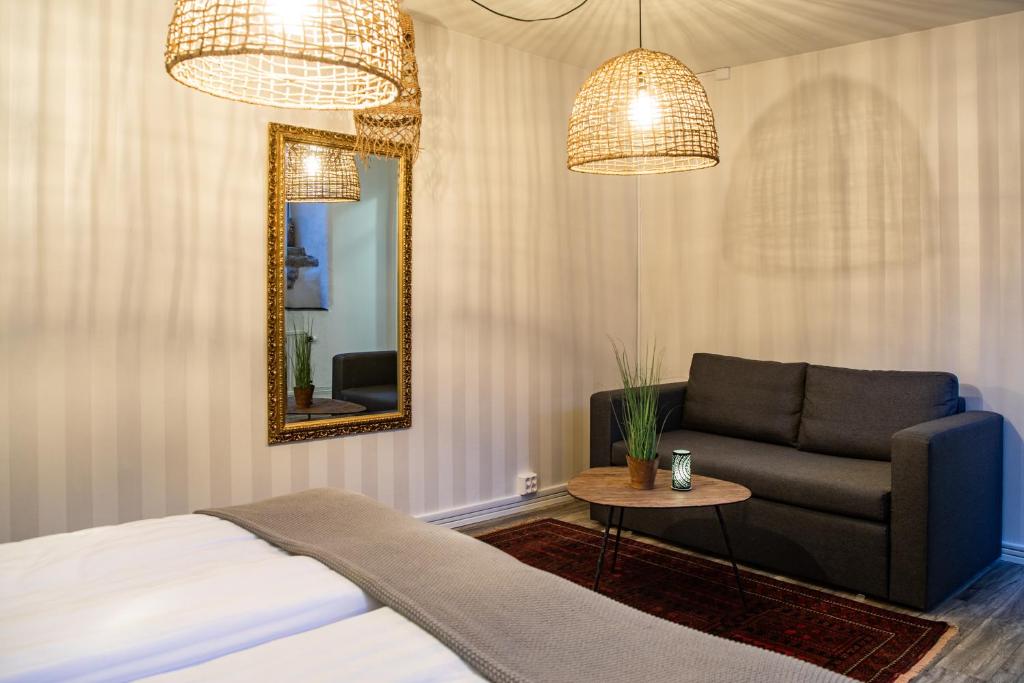 Postel nebo postele na pokoji v ubytování Hotell Lindgården