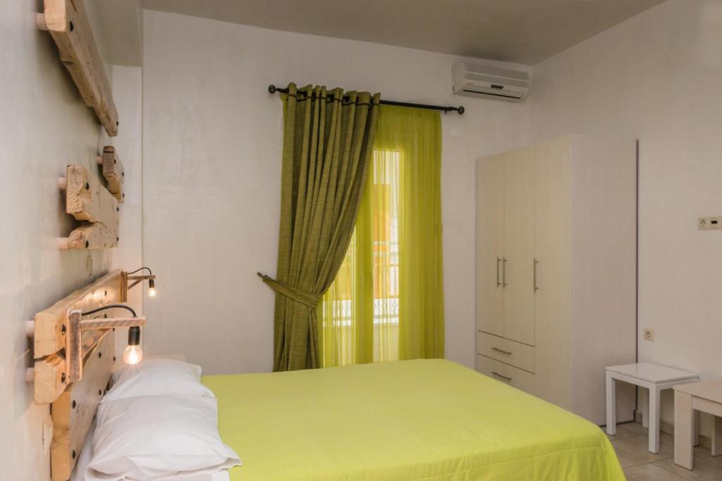 Postel nebo postele na pokoji v ubytování Hotel Sunshine Matala