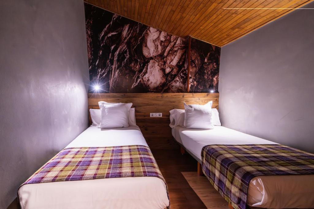 Postel nebo postele na pokoji v ubytování Hotel AnyosPark Mountain & Wellness Resort