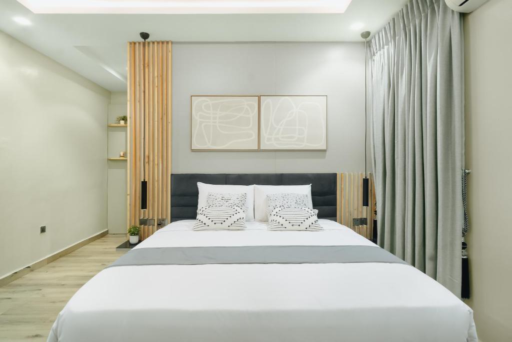 Postel nebo postele na pokoji v ubytování Kashco Apartments Wuse 2 Abuja
