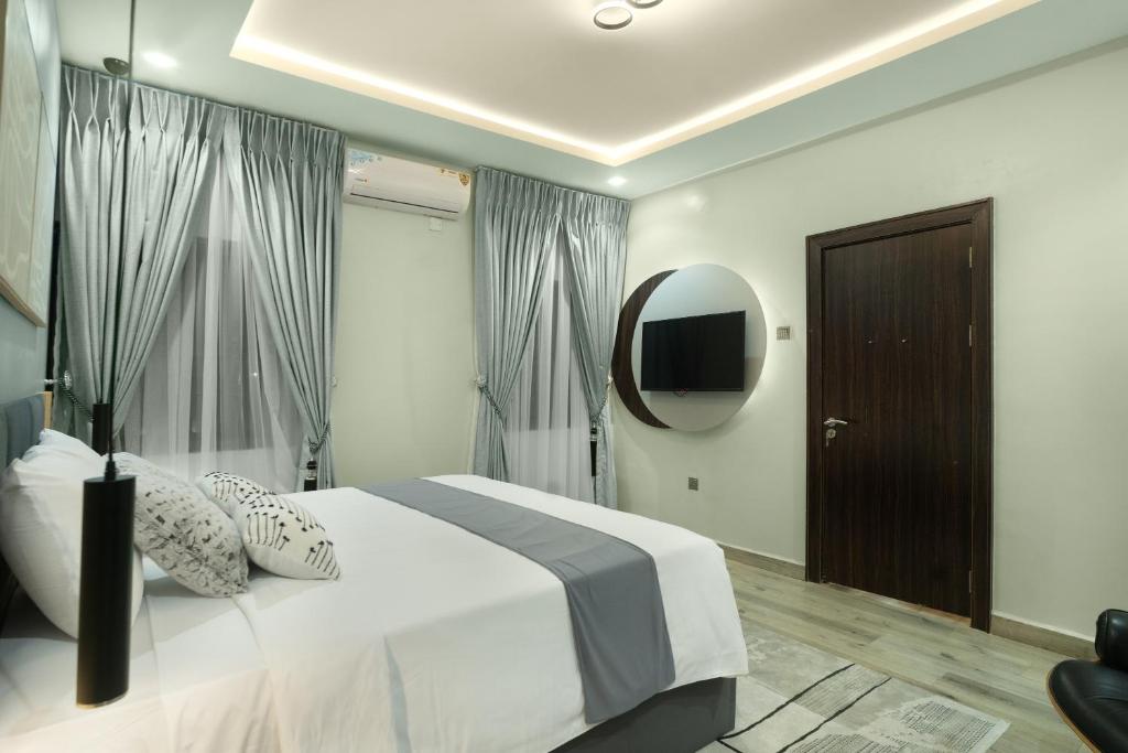 Postel nebo postele na pokoji v ubytování Kashco Apartments Wuse 2 Abuja