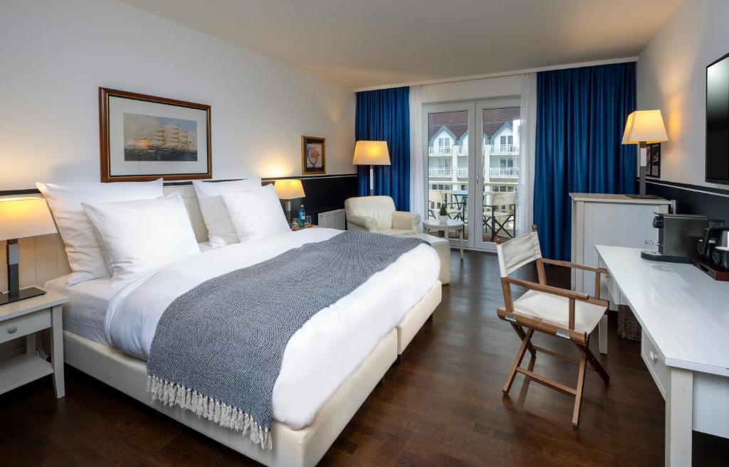 Ein Bett oder Betten in einem Zimmer der Unterkunft Precise Resort Hafendorf Rheinsberg