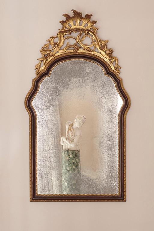 a mirror with a picture of a woman holding a child at Violino d&#39;Oro Venezia in Venice