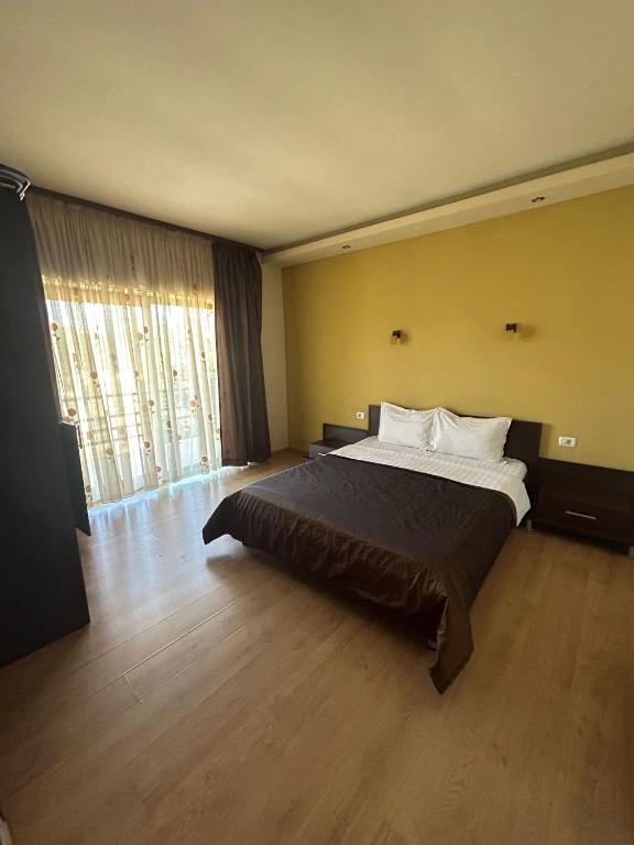 Ένα ή περισσότερα κρεβάτια σε δωμάτιο στο Casa Andrei Maria