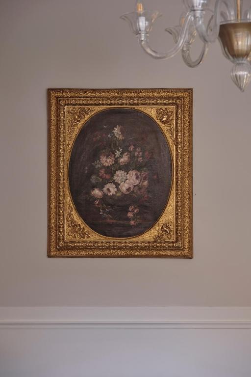 a picture of a painting of flowers on a wall at Violino d&#39;Oro Venezia in Venice