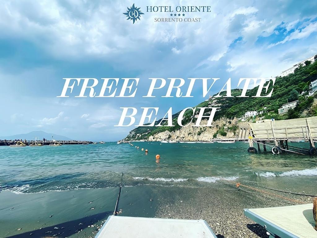 a picture of a beach with the words free pineapple beach at Hotel Oriente in Vico Equense