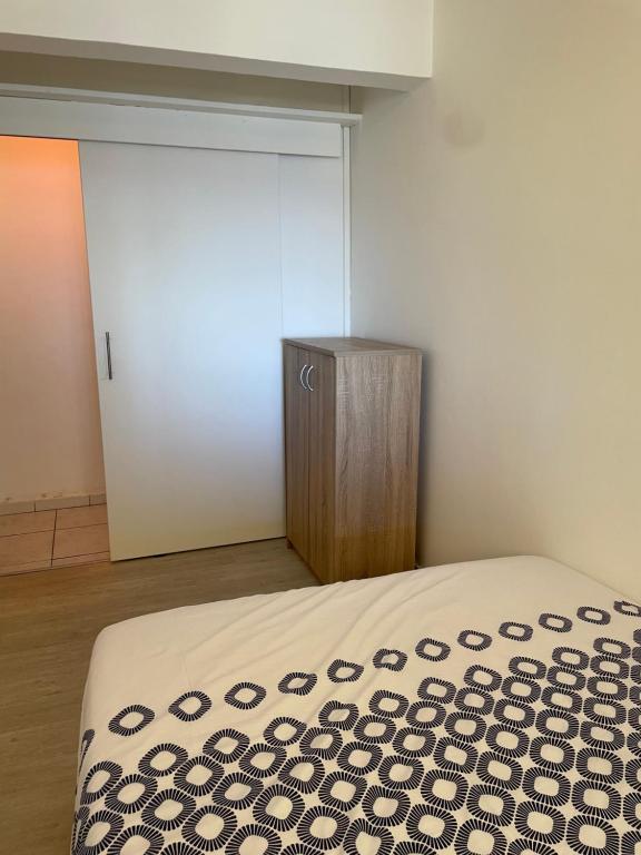 Postel nebo postele na pokoji v ubytování Sur La Mer - Appartement Deux chambres à Schoelcher