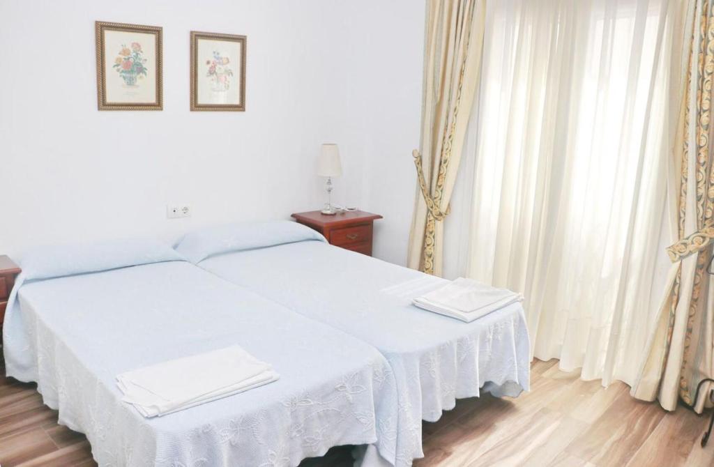 Posteľ alebo postele v izbe v ubytovaní Apartamento Trafalgar
