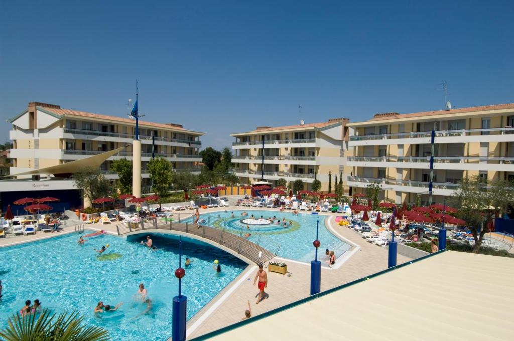 a group of people in a pool at a resort at Villaggio Planetarium Resort in Bibione