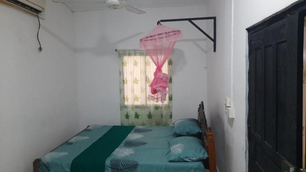 Postel nebo postele na pokoji v ubytování KANTHI GUEST INN