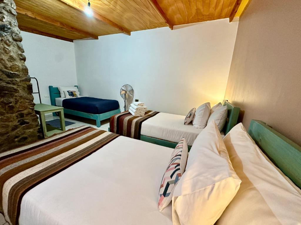 Postel nebo postele na pokoji v ubytování Hostal Qachi Chentura