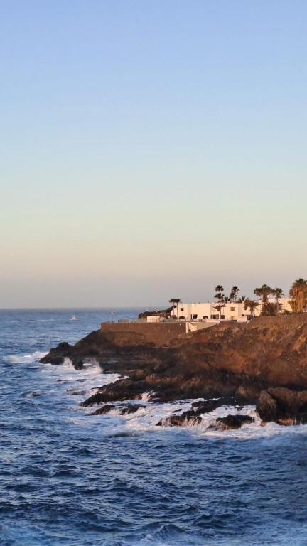 a group of houses on a cliff near the ocean at VILLA SISSI Atlantic View in Costa Del Silencio