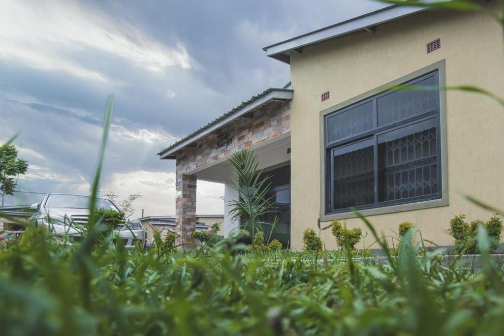 a house with a window on the side of it at Kumwitu Luxury Apartments in Lusaka