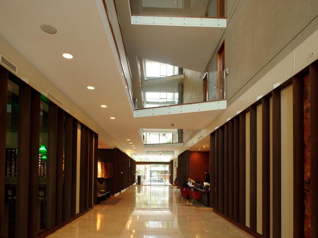 an empty hallway in a building with a ceiling at NOI Vitacura in Santiago