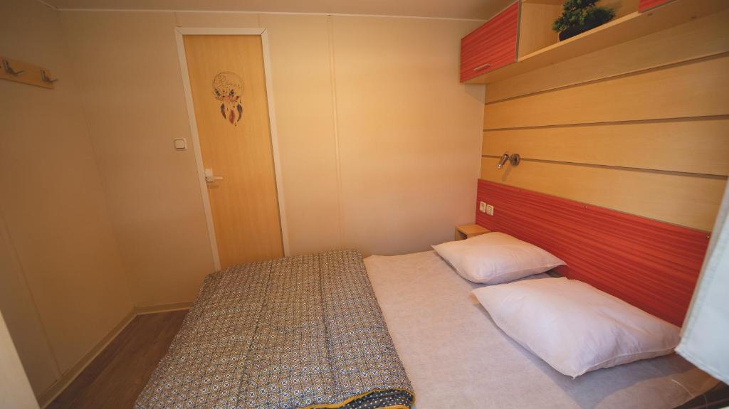 Postel nebo postele na pokoji v ubytování Le Muscat