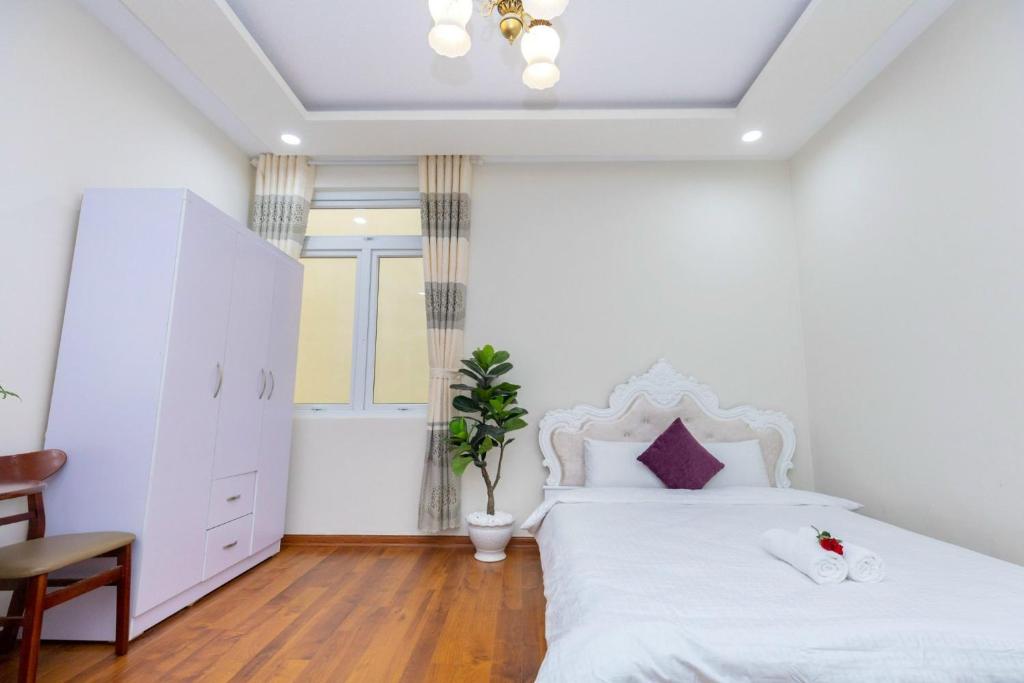 Postel nebo postele na pokoji v ubytování Villa Đà Lạt GD - Biệt Thự Đà Lạt GD Gần Hồ Xuân Hương Gần Chợ