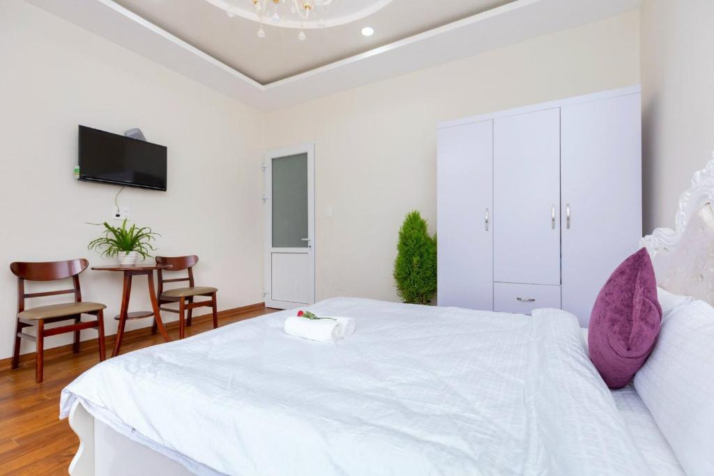 Postel nebo postele na pokoji v ubytování Villa Đà Lạt GD - Biệt Thự Đà Lạt GD Gần Hồ Xuân Hương Gần Chợ