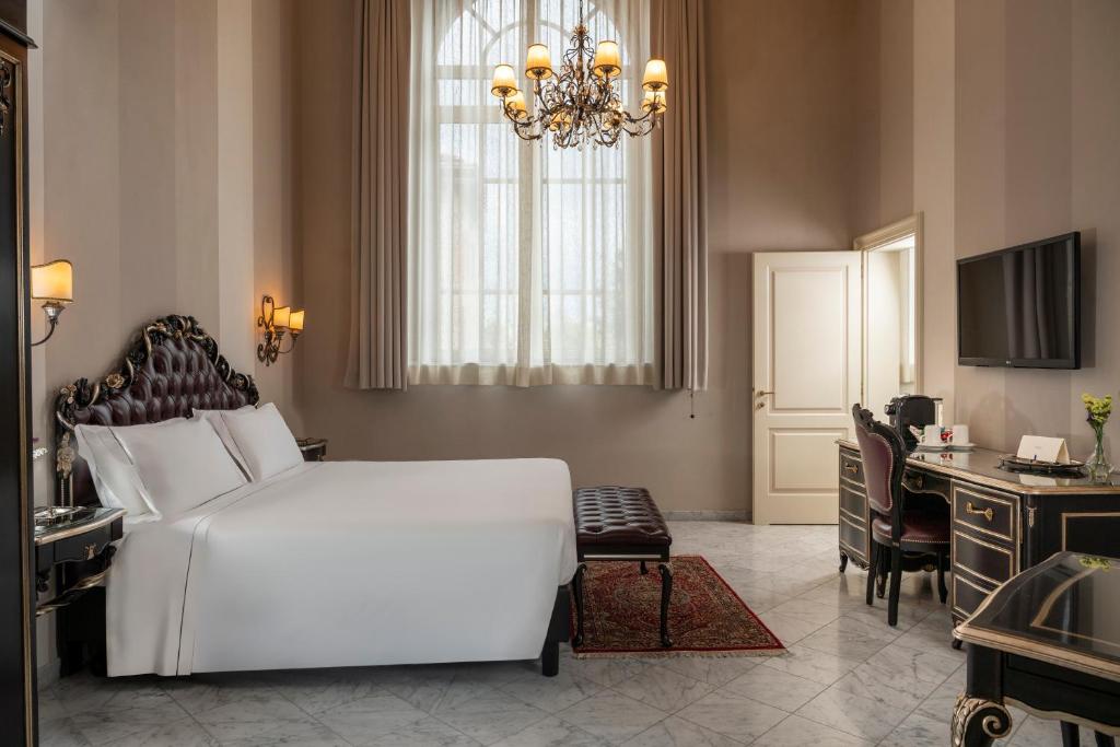 TV a/nebo společenská místnost v ubytování Grand Hotel di Parma | UNA Esperienze