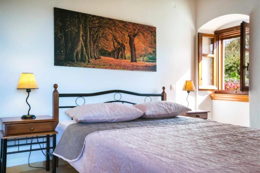 Postel nebo postele na pokoji v ubytování 1841 Petrino Villa