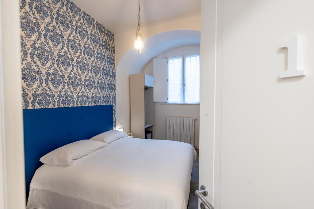 Postel nebo postele na pokoji v ubytování B&B Via Corsica 10