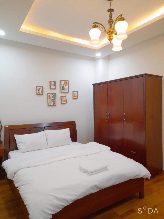 Postel nebo postele na pokoji v ubytování Villa Đà Lạt GD - Biệt Thự Đà Lạt GD Gần Hồ Xuân Hương Gần Chợ
