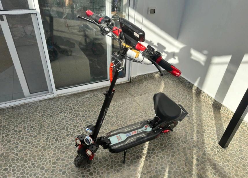 a scooter parked on a floor in a room at Аренда Электросамокатов в Шарм Эль Шейхе in Sharm El Sheikh