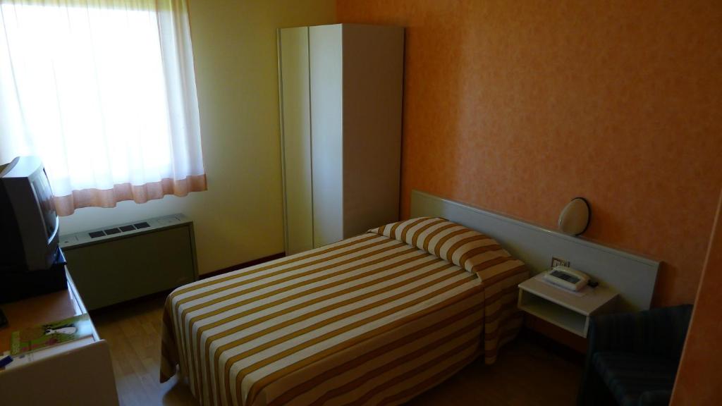 Llit o llits en una habitació de Hotel Grassetti