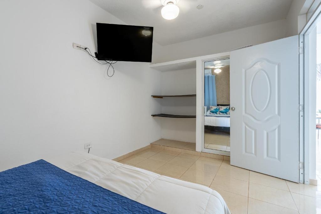 Postel nebo postele na pokoji v ubytování EDMA APARTAHOTEL