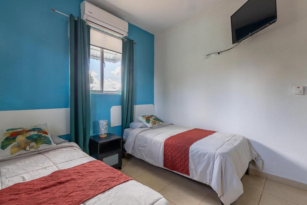 Postel nebo postele na pokoji v ubytování EDMA APARTAHOTEL