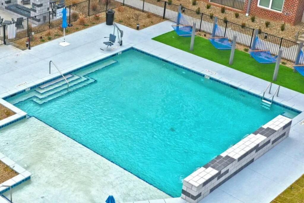 an overhead view of a large swimming pool at Downtown Augusta Beauty 2 Bed Apt in Augusta
