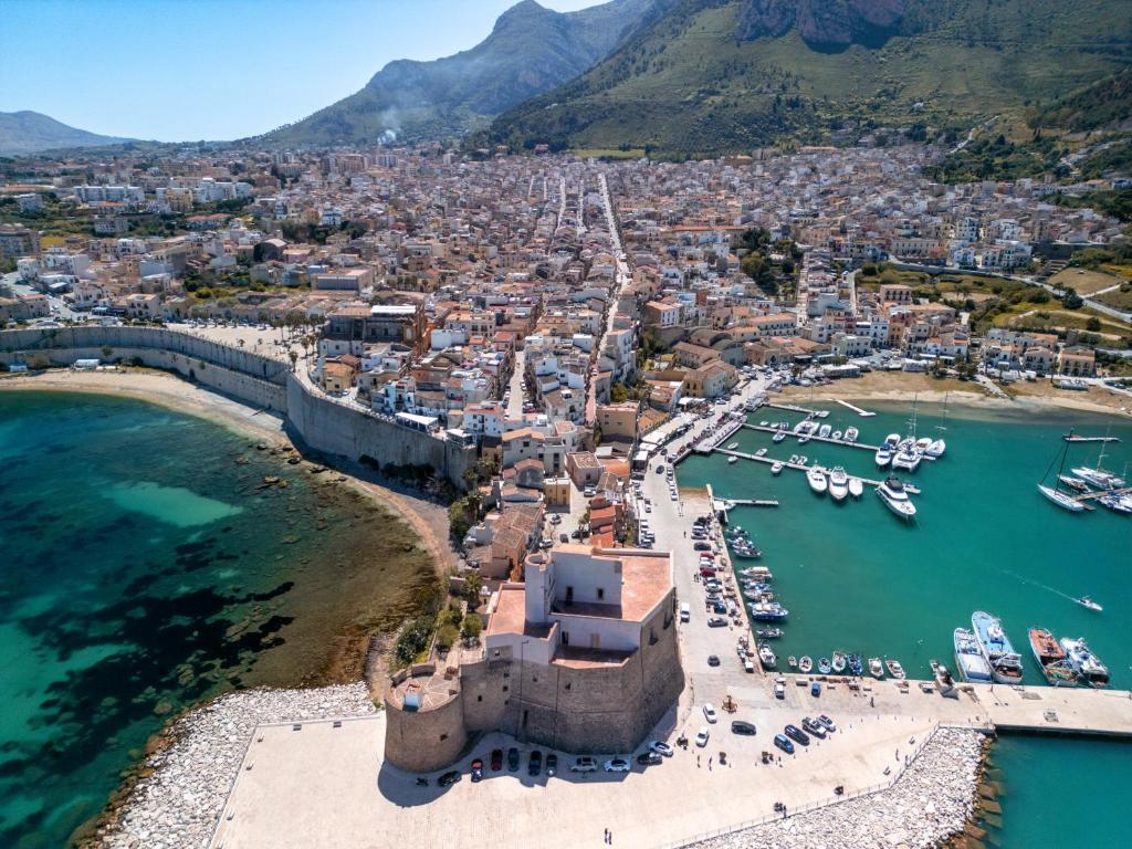 an aerial view of a harbor with boats in the water at La Casetta sul mare in Castellammare del Golfo