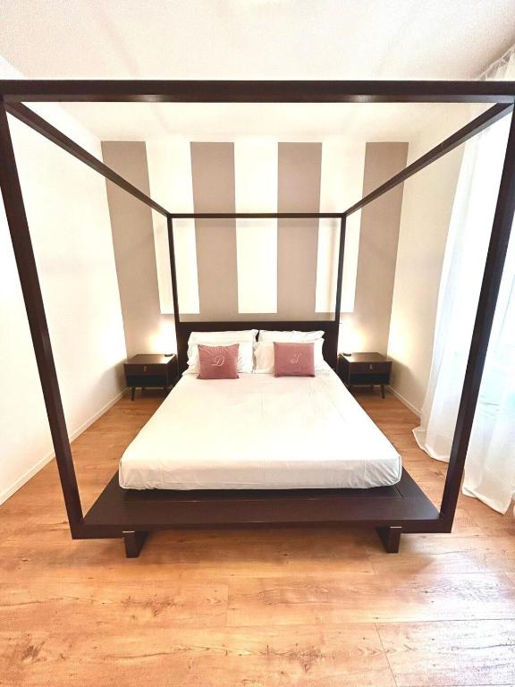 Postel nebo postele na pokoji v ubytování Fiera Maison