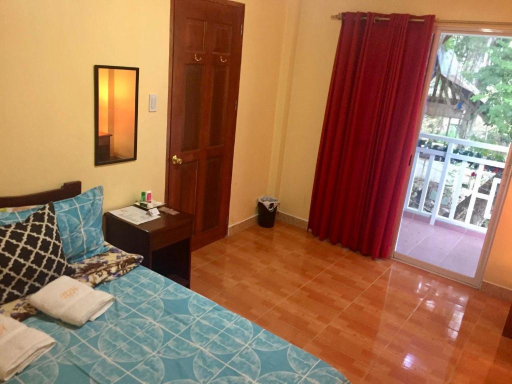 Voodi või voodid majutusasutuse TGH Guest House Badian toas