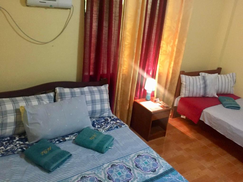 Voodi või voodid majutusasutuse TGH Guest House Badian toas
