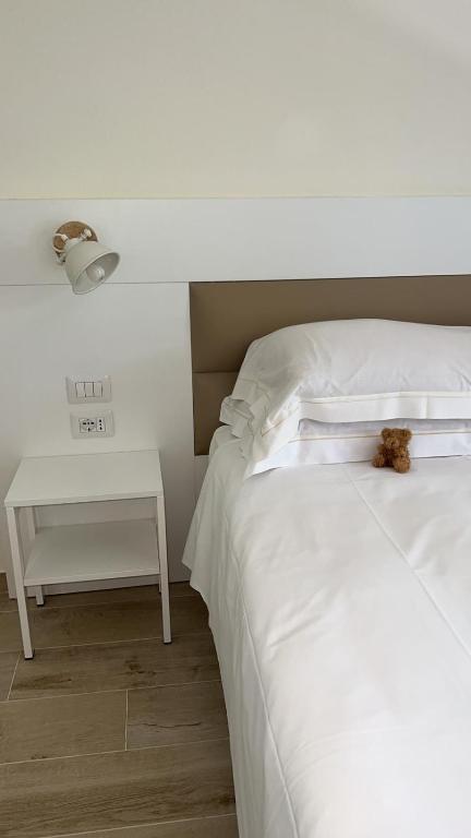 Postel nebo postele na pokoji v ubytování Dimora Punta Ala
